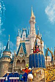 Disney characters perform in front of the Cinderella Castle, Magic Kingdom, Walt Disney World, Orlando, Florida USA