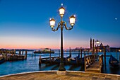 Sunrise over San Giorgio Maggiore with gondolas in the foreground, Venice, Italy, Europe