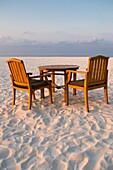 Table and chairs on a beach in the Maldives