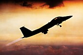 Silhouette of an Israeli Air force F-15I Fighter in flight at sunset