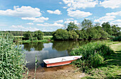 Boat on the bank of Spree river, Radinkendorf, Beeskow, Land Brandenburg, Germany, Europe