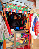 Salesman in his fabric shop, centre of Leh, Ladakh, Jammu and Kashmir, India