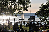 People at lake Ammersee at sunset, Herrsching, Upper Bavaria, Germany, Europe