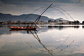 Fisherman with traditional fishing net in a lagoon, Mesolongi, Western Greece, Europe