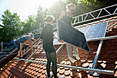 School project, students installing a solar plant, Freiburg im Breisgau, Black Forest, Baden-Wuerttemberg, Germany, Europe