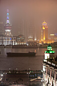 Fairmont Peace Hotel on Nanjing Road with 'The Bund' at the Huangpu River, view towards the special economic area Pudong, Shanghai, China