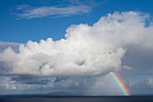 View of clouds and rainbow in Outer Hebrides Isles from Skye Island in Argyll and Bute, Scotland