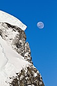View of the moon rising over snow-covered mountains on the Antarctic Peninsula, Antarctica. View of the moon rising over snow-covered mountains on the Antarctic Peninsula, Antarctica MORE INFO Lindblad Expeditions pioneered non-scientific travel to Antarc
