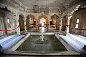 Fountain and bird cages at City Palace Museum, Udaipur, Rajasthan, India