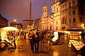 evening wak with street artists and paintings on the Piazza Navona square in Rome, Lazio, Italy, Europe