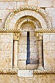 Windows with arches, carved capitals and imposts checkered in the Romanesque church of El Almiñe - Valle de Valdivielso - Burgos - Castilla y Leon - Spain - Europe