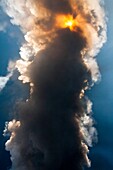 View of sun shining through volcanic ash cloud during Mount Etna eruption on 8th September 2011, Sicily, Italy