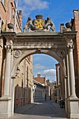 An arch leading to a street in Bruges, Belgium