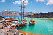 Excursion boats at the harbour of Nea Kameni Island, Santorini, Cyclades, Greece