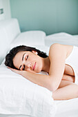 Portrait of a pretty woman sleeping in bed