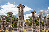 Columns in the Temple of a Thousand Warriors. Stellae in the  pre-Columbian or Mayan city temple. Carvings and pillars. Archaeological site. Temple.