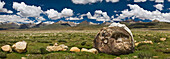 Mani Rocks carved with the Tibetan mantra Om Mani Padme Hum. Buddhist place of pilgrimage, and path to a sacred site. Tibet Autonomous Region near Lake Namtso.