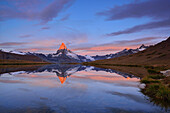 Matterhorn reflecting in a mountain lake, Pennine Alps, Valais, Switzerland