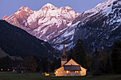 Dusk at the catholic church of Kandersteg and Bluemlisalpmassiv, Bernese Oberland, Canton of Bern, Switzerland