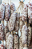 Italian sausage hung up to dry, Lago di Garda, Province of Verona, Northern Italy, Italy