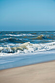 Sandy beach and waves on the island of Sylt, Schleswig-Holstein, Germany