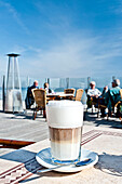 Latte macchiato in a cafe with seaview, Scharbeutz, Schleswig Holstein, Germany