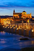 Guadalquivir river, Roman bridge and mosque-cathedral at Dusk  Córdoba  Andalusia  Spain