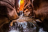 Hiking in a slot canyon en route to Kanarra Creek Falls, near Cedar City, Utah USA