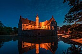 The illuminated moated castle of Vischering, Luedinghausen, North Rhine-Westphalia, Germany, Europe