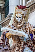 A masked woman at the carnival in Venice, Italy, Europe