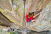 Nic Houser rock climbing a route called Yellow Wall which is rated 5,9 and located on The Yellow Wall at The City Of Rocks National Reserve near the town of Almo in southern Idaho