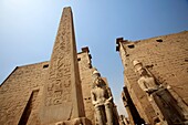 Entrance of Luxor Temple with red granite obelisk, Luxor, Egypt