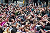 Thousands of yoga practitioners in Times Square in New York participate in a mid-day Bikram Yoga class on the first day of summer Temperatures are expected to rise into the upper 90´s today as most New Yorkers seek relief from the heat