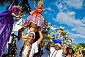 Baiana women carry religious figurines during the ritual procession in honor to Yemanjá, the Candomblé goddess of the sea, in Amoreiras, Bahia, Brazil, 3 February 2012  Yemanjá, originally from the ancient Yoruba mythology, is one of the most popular ‘ori