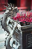 A dragon adornment on the side of an incense alter at the Temple of Literature