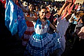 Dancers wearing traditional clothing perfom in the Guelaguetza parade in Oaxaca, Mexico, July 21, 2012  Oaxaca commemorates the ´Guelaguetza,´ an annual celebration by all seven of the state´s regions, as they converge on the capital to demonstrate their.