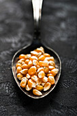 Unpopped Popcorn Kernels in Spoon, Close Up