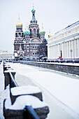 the Church of the Savior on Spilled Blood, a traditional Russian Orthodox church built in 1907, on the The Griboedov Canal. Winter. Snow.