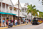 The Conch Tour Train on the main shopping street, Duval Street, Key West, Florida Keys, USA