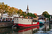 Houseboats in the Ill River along the Quai de Pecheurs, Strasbourg, France