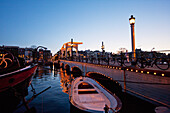 Magere Brug over the Amstel river at night, Amsterdam, Netherlands