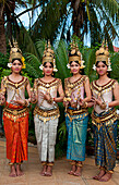 Cambodia, Siem Reap, Four young dancers wearing traditional costumes, posing.