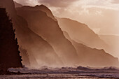 Hawaii, Kauai, North Shore, Na Pali Coast, Haena, Misty waves at dusk.