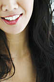 Close-up on the mouth of a beautiful asian woman.