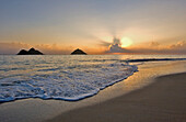 Hawaii, Oahu, Lanikai, view of the Mokulua islands at sunrise.