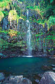 Hawaii, Maui, Hana, Waterfall along highway, pool at base of falls