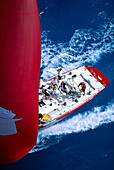 Florida, Miami, Short Ocean Racing Championship (SORC), Close-up top view of crew, yacht with red sail C1301