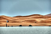 Sand dunes in Sahara with lake near Merzouga, Erg Chebbi, Morocco