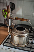 Tea kettle on an oven in the Kitchen, Domestic life