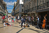 Street musicians performing on Rua Augusta pedestrian street in Baixa district, Lisbon, Lisboa, Portugal